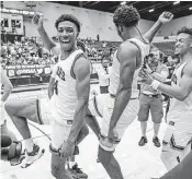  ?? AL DIAZ adiaz@miamiheral­d.com ?? Mater Lakes Academy’s Ian Pascal (4) and Christian Reid celebrate after defeating The Villages Charter on Saturday.