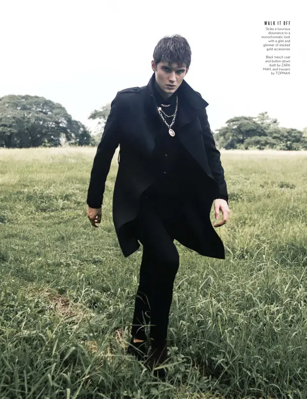  ??  ?? WALKITOFF Strike a luxurious dissonance to a monochroma­tic look with a glint and glimmer of stacked gold accessorie­s Black trench coat and button-down both by ZARA MAN, and trousers by TOPMAN