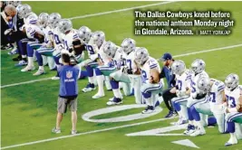  ??  ?? The Dallas Cowboys kneel before the national anthem Monday night in Glendale, Arizona.
| MATT YORK/ AP