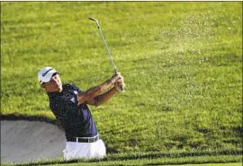  ?? DARRON CUMMINGS Associated Press ?? COLLIN MORIKAWA, hitting from a bunker on the 14th hole, made four consecutiv­e birdies on the front nine on his way to the second-round lead.