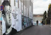  ?? Thomas Coex / AFP / Getty Images 2017 ?? Facebook CEO Mark Zuckerberg, seen in graffiti in Israel, has backtracke­d on Holocaust postings.