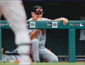  ?? Bay Area News Group/tns ?? San Francisco Giants’ manager Bruce Bochy watches from the bench in the ninth inning of a baseball game against the Colorado Rockies Sunday in Denver. The Rockies won 6-2.