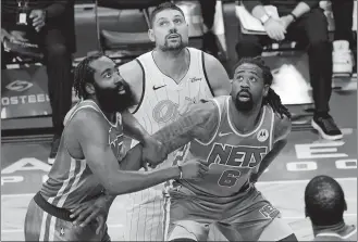  ?? MARY ALTAFFER/AP PHOTO ?? Brooklyn Nets guard James Harden, left, center DeAndre Jordan, right, and Orlando Magic center Nikola Vucevic, center, jostle for position during a free throw in the second half of Saturday’s game.