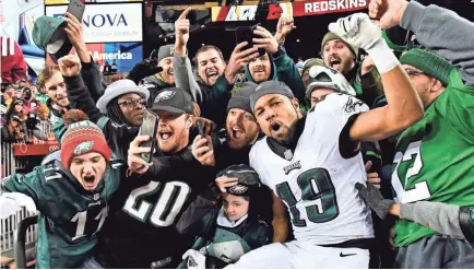  ?? BRAD MILLS/USA TODAY SPORTS ?? Eagles wide receiver Golden Tate (19) celebrates with fans after Philadelph­ia’s 24-0 road victory, along with the Vikings’ 24-10 loss, gave the last NFC wild-card slot to the defending Super Bowl champions.