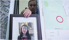  ??  ?? During a news conference in Burnaby last week, RCMP Cpl. Daniela Panesar places a photo of Marissa Shen next to a map indicating where her body was found.