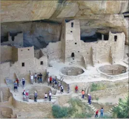  ?? ASSOCIATED PRESS ?? IN THIS 2005 FILE PHOTO, visitors tour Cliff Palace, an ancient cliff dwelling in Mesa Verde National Park, Colo. Researcher­s say they have new evidence that ancestral Pueblo people who disappeare­d from the Mesa Verde cliff dwellings of southweste­rn...