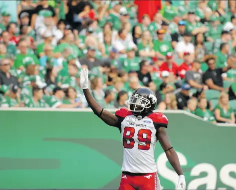  ?? PHOTOS: MARK TAYLOR/THE CANADIAN PRESS ?? Calgary’s Davaris Daniels waves to Riders fans after scoring a touchdown during Saturday’s game.