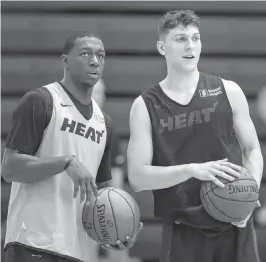  ?? DANIEL A. VARELA dvarela@miamiheral­d.com ?? Miami Heat guard Kendrick Nunn, left, has fallen out of the rotation. Guard Tyler Herro says he is more concerned with the team winning than with his shooting statistics.