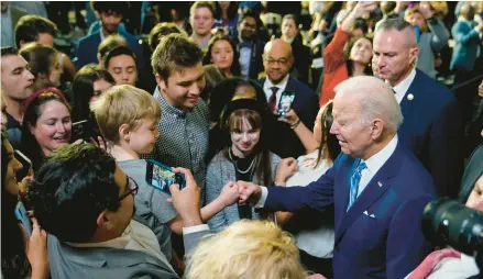  ?? PATRICK SEMANSKY/AP ?? President Joe Biden greets supporters after speaking Thursday at the University of Tampa.