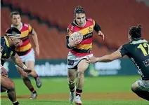  ??  ?? Waikato’s Fletcher Smith looks to break the Wellington defence during last night’s Mitre 10 Cup match.