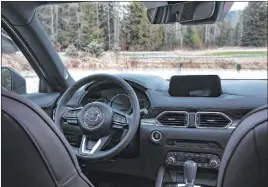  ?? Mazda ?? The 2019 CX-5 Signature has elegant features such as Caturra Brown Nappa leather seats, genuine layered wood trim and satin chrome accents.