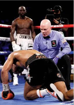  ?? Photo: STEVE MARCUS/GETTY IMAGES ?? NO MEAN FEAT: Crawford has Porter down on the canvas