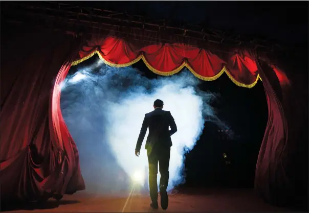  ?? (AP Photo/Esteban Felix) ?? Timoteo Circus conductor and administra­tive manager Stefano Rubio takes the stage Dec. 9 on the outskirts of Santiago, Chile.