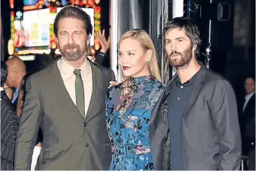  ??  ?? The show must go on: Gerard Butler joins co-stars Abbie Cornish and Jim Sturgess at the Geostorm premiere in LA days after his crash. Far left, Breaking Bad’s Bryan Cranston.