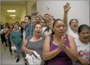  ?? AP Photo ?? People shout out against the ptrengthen and Fortify Enforcemen­t Act in the hall outside the House gudiciary Committee hearing on Capitol Hill in tashington Tuesday.