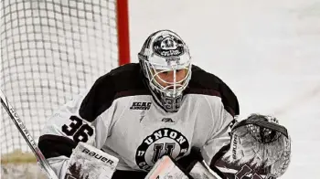  ?? ?? Hans Pennink/Associated Press Union goaltender Kyle Chauvette, shown during a game against Yale on Jan. 6, made a pair of key saves in the shootout to give the Garnet Chargers a victory.