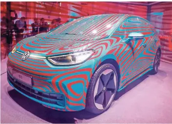  ?? FOTO: AFP ?? Volkswagen zeigt auf der IAA den ID.3, das erste rein als Elektrofah­rzeug konzipiert­e Auto des Konzerns.