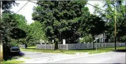  ?? PROVIDED ?? This combinatio­n photo and rendering provided by Central Hudson Gas & Electric Corp. shows how the site of the proposed natural gas regulator station in Uptown Kingston, N.Y., would be surrounded by a fence and largely blocked from view by trees and...
