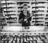  ?? ELAINE THOMPSON / AP ?? Gun shop owner Tiffany Teasdale-Causer poses for a photo with a Ruger AR-15 semi-automatic rif le, the same model used by the shooter in the Texas church massacre. Gun-rights supporters have seized on the Texas church massacre as proof of the well-worn...