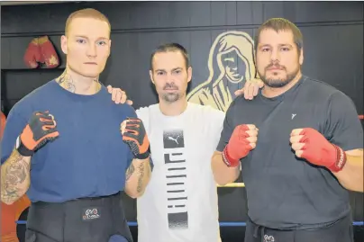  ?? T.J. COLELLO/CAPE BRETON POST ?? Ryan Rozicki of Sydney Forks, left, and Steve Whitall of Eskasoni, right, are shown with Thunder Boxing coach Glen Williams before a sparring session at the Sydney club this week. The two fighters were preparing for a pro boxing card on Saturday at...