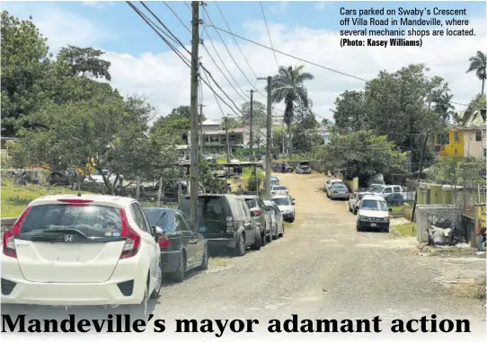  ?? (Photo: Kasey Williams) ?? Cars parked on Swaby’s Crescent off Villa Road in Mandeville, where several mechanic shops are located.