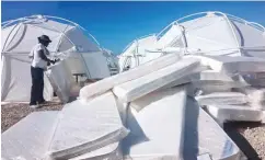  ?? — AP ?? This photo provided by Jake Strang shows mattress and tents set up for attendees of the Fyre Festival, Friday in the Exuma islands, Bahamas.