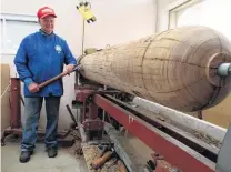  ?? PHOTO:RUBY HEYWARD ?? Big pole, big job . . . Waitaki Woodturner­s Guild treasurer Bill Owen gets ready to reshape an old power pole, which will be used for Holmes Wharf’s new and improved observator­y deck in Oamaru.