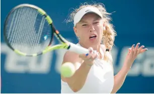  ?? AP ?? Caroline Wozniacki hits a forehand against Karolina Pliskova. —