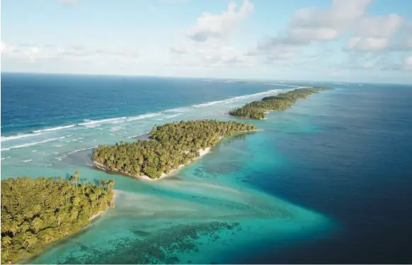  ?? AP PHOTO ?? This Oct. 23, 2017 aerial photo shows the thin strip of coral atolls separating the ocean from the lagoon in Majuro, Marshall Islands.