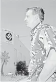  ?? AP FILE PHOTO ?? John Houser with a swastika banner on his pub in LaGrange, Ga., in 2001.
