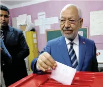  ?? Reuters ?? Rached Ghannouchi, head of the Ennahda party, casts his vote at a polling station for the municipal election in Tunis. —