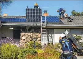  ?? Mel Melcon Los Angeles Times ?? BIG UTILITIES say solar customers’ savings through an incentive program are so great that they end up not paying their fair share to operate the power grid.