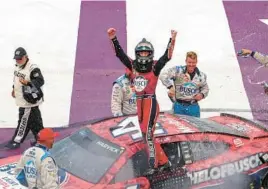  ?? MIKE MULHOLLAND/GETTY ?? Kevin Harvick celebrates Sunday after ending a 65-race winless streak with his sixth career NASCAR Cup victory at Michigan Internatio­nal Speedway.