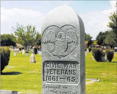  ?? Michael Quine ?? Las Vegas Review-journal @Vegas88s A granite pillar marks the gravesite of two Civil War veterans, William Keith who wore blue and Joseph Graham who wore gray, at Woodlawn Cemetery.