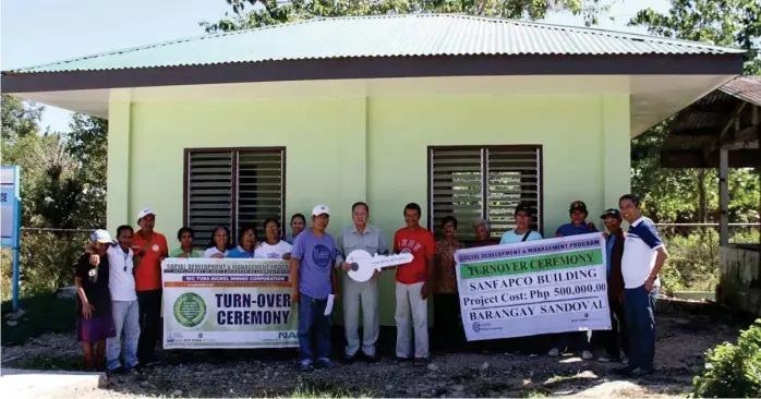  ??  ?? CBNC and RTNMC award to Sandoval Farmers’ Producers Cooperativ­e (SANFAPCO) the P500, 000 worth of building as a support to social enterprise initiative­s of the community. (Photo courtesy of CBNC).