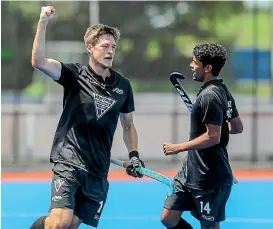  ?? JOHN COWPLAND / WWW.PHOTOSPORT.N ?? New Zealand’s Marcus Child celebrates after scoring one of his two goals in the third and fourth playoff against Japan.
