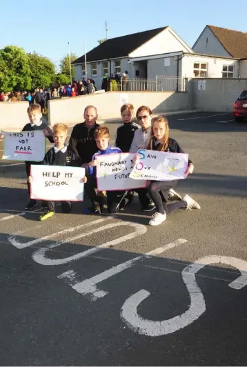  ??  ?? Some of the group of parents and pupils at the Save Our School campaign at Scoil Naisiunta Bhrighde in Faughart.