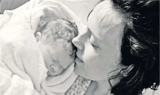  ??  ?? > Rhiannon Davies with daughter Kate Stanton Davies who died shortly after birth in 2009. An inquiry into maternity care at a the hospital trust is likely to be the NHS’s worst ever maternity scandal