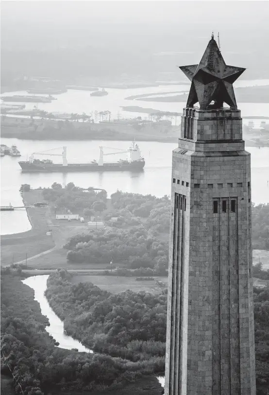  ?? Houston Chronicle file ?? An aerial view as a ship navigates the Houston Ship Channel behind the San Jacinto Monument.