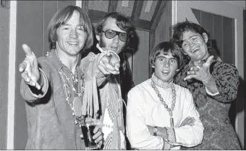  ?? Ray Howard / Associated Press archive ?? Peter Tork, left, with Mike Nesmith, David Jones and Micky Dolenz of The Monkees July 6, 1967. Tork rocketed to teen idol fame playing the lovable, clueless bass guitarist in the band.