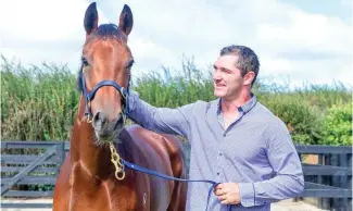  ?? PHOTO: MICHAEL RIST ?? Stephen Donald with the as yet unnamed two-year old filly.