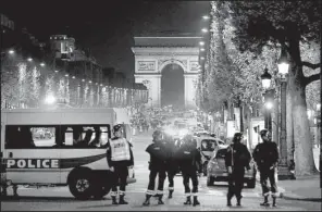  ?? AP/ KAMIL ZIHNIOGLU ?? Police seal off the Champs Elysees in Paris after a gunman targeted police officers Thursday near a subway station.