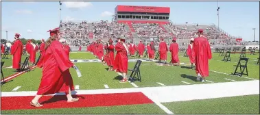  ??  ?? Black chairs for Farmington graduates were spread out the width of the Cardinal football field and were placed from the 10-yard line near the scoreboard to the 30-yard line on the other end of the field. Each graduate had 10 tickets and guests sat in the visitor and home bleachers.