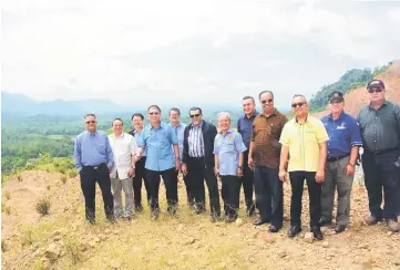  ??  ?? Julaihi (fourth left) seen with (from sixth left) Hasbi, Paulus and others at the foot of Bukit Kemau during the site visit.