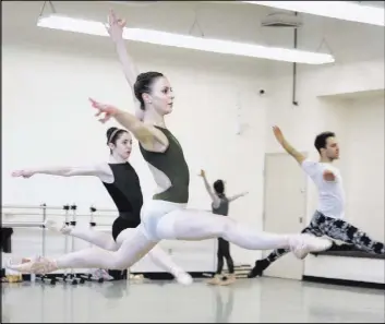  ?? Bill Hughes Las Vegas Review-Journal ?? Christina Ghiardi rehearses with fellow Nevada Ballet Theatre dancers for this weekend’s world premiere of choreograp­her Matthew Neenan’s “Until December.”