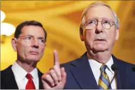  ?? AP PHOTO ?? Senate Majority Leader Mitch McConnell of Ky., right, accompanie­d by Sen. John Barrasso, R-Wyo., speaks on Capitol Hill in Washington.