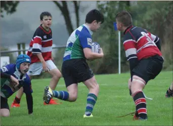  ??  ?? Jack Curley bursting through to score a second-half try.