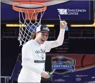  ?? Hans Pennink / Associated Press ?? Quinnipiac’s Jen Fay cuts down the net after defeating Marist in the 2019 MAAC Tournament championsh­ip. Fay was named an assistant coach with the Bobcats on Friday.