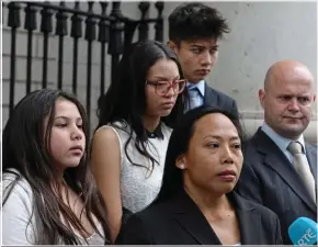  ??  ?? Angela Neiland surrounded by her family as she spoke to the media outside court on Thursday