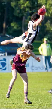  ?? ?? Sale’s Cooper Whitehill flies overhead Drouin’s James McKeller in a marking attempt.